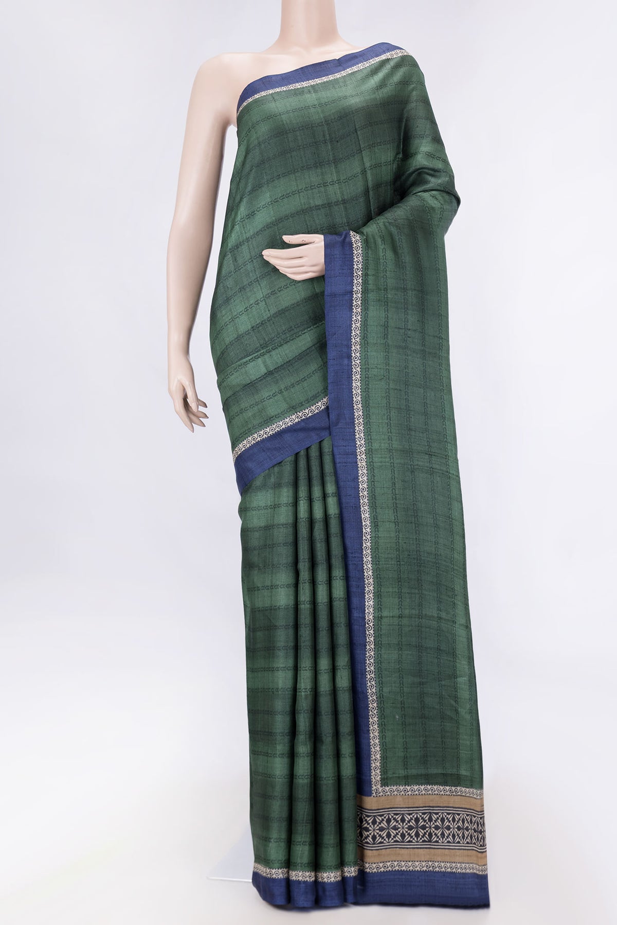 Green Dual Tone Tussar Silk SareePrinted design on the body and Plain Border displayed on a mannequin
