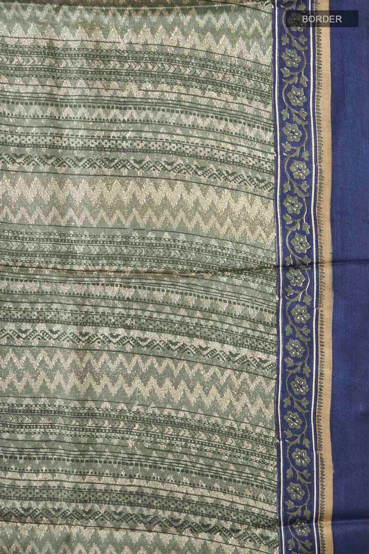 Border image of Green Tussar Silk Saree with Printed design on the body and Plain Border