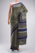 Green Tussar Silk Saree with Printed design on the body and Plain Border displayed on a mannequin