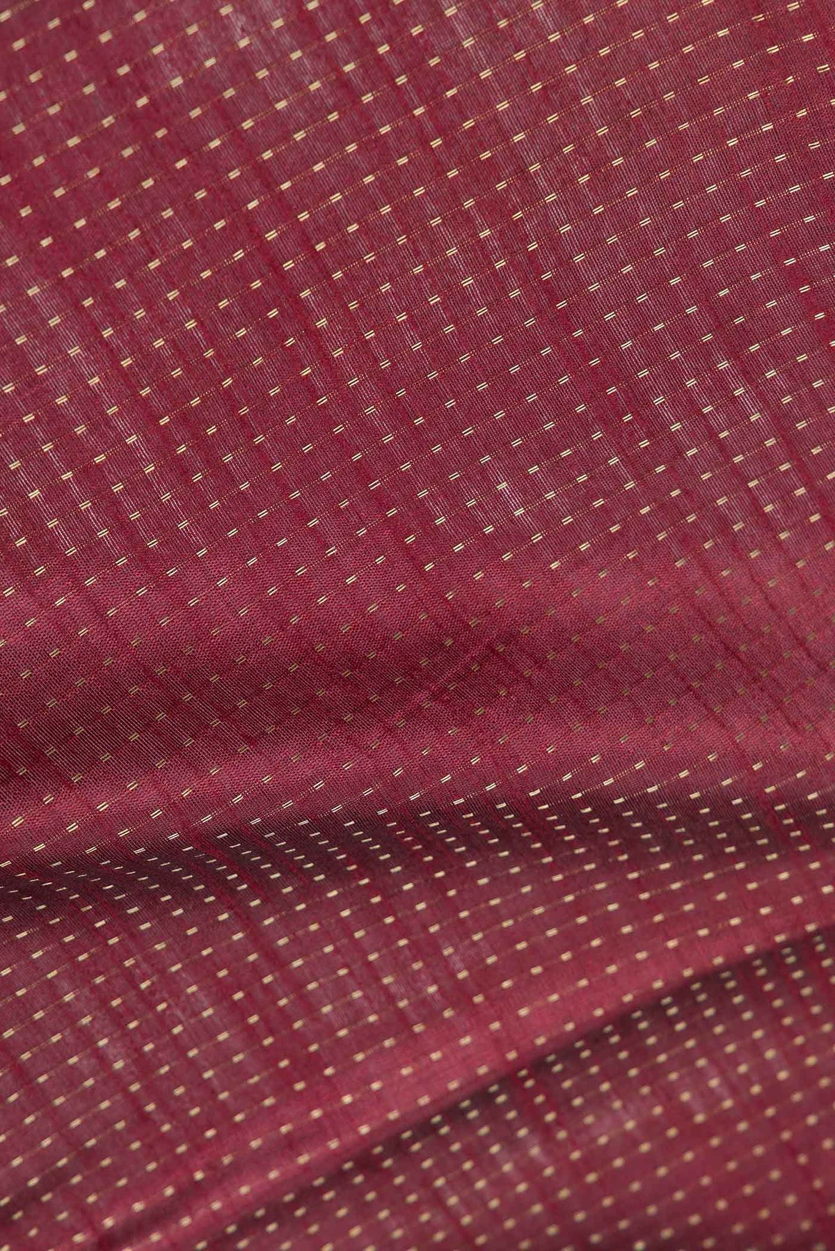 Close up of Maroon Dual Tone Tussar Saree with Stripes on the body and Embroidery Border displaying folds
