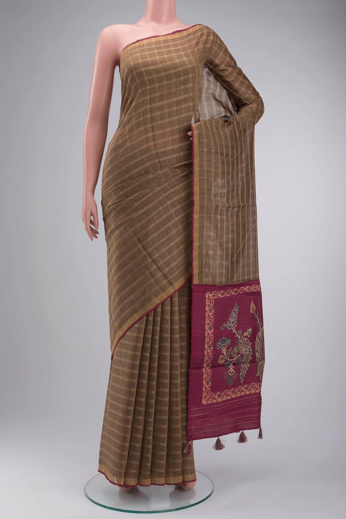 Beige Tussar Silk Saree with Checked design on the body and Zari Border displayed on a mannequin