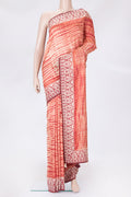 Golden Peach Dual Tone Tussar Silk Saree with Printed design on the body and Embroidery Border.  displayed on a mannequin