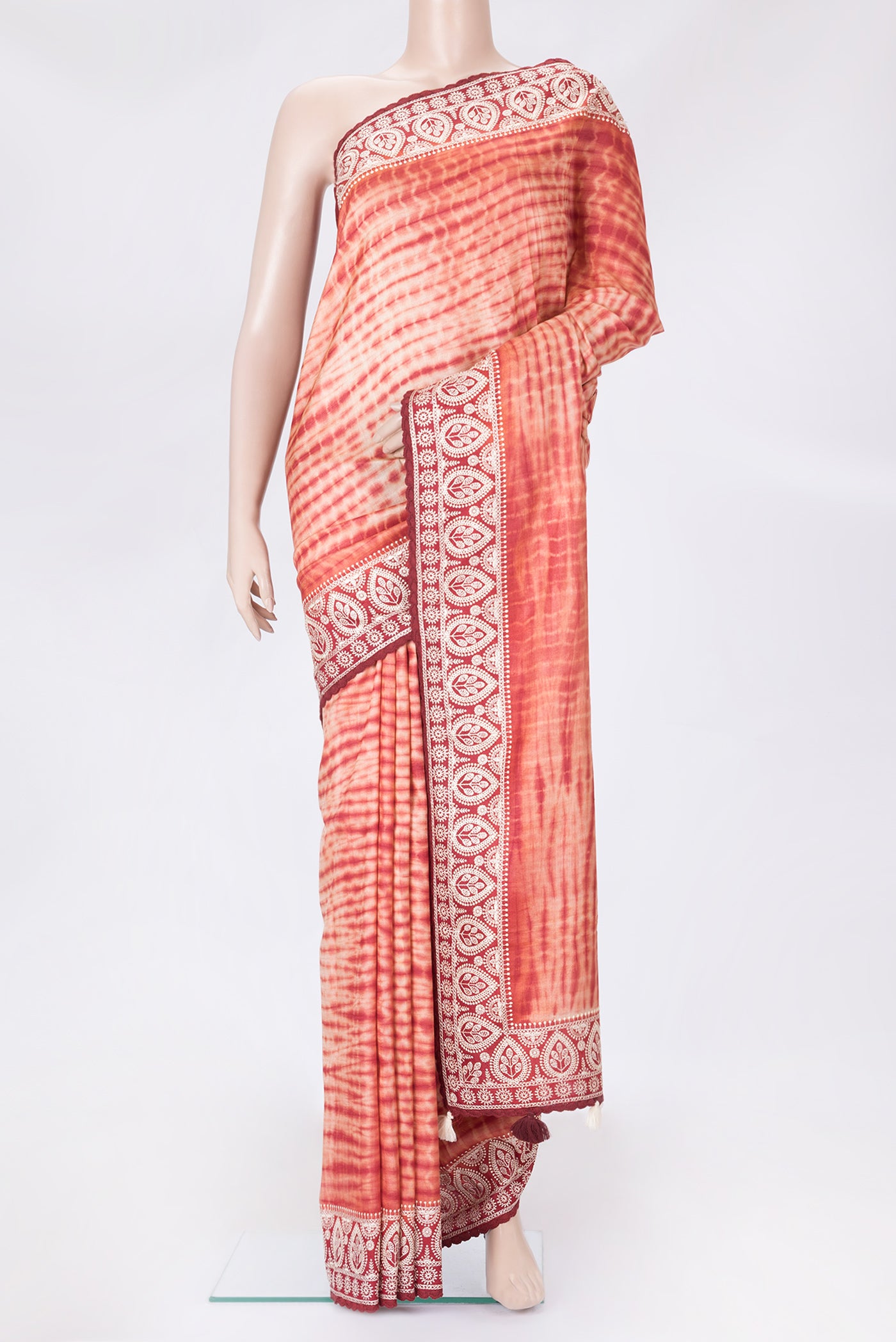Golden Peach Dual Tone Tussar Silk Saree with Printed design on the body and Embroidery Border.  displayed on a mannequin