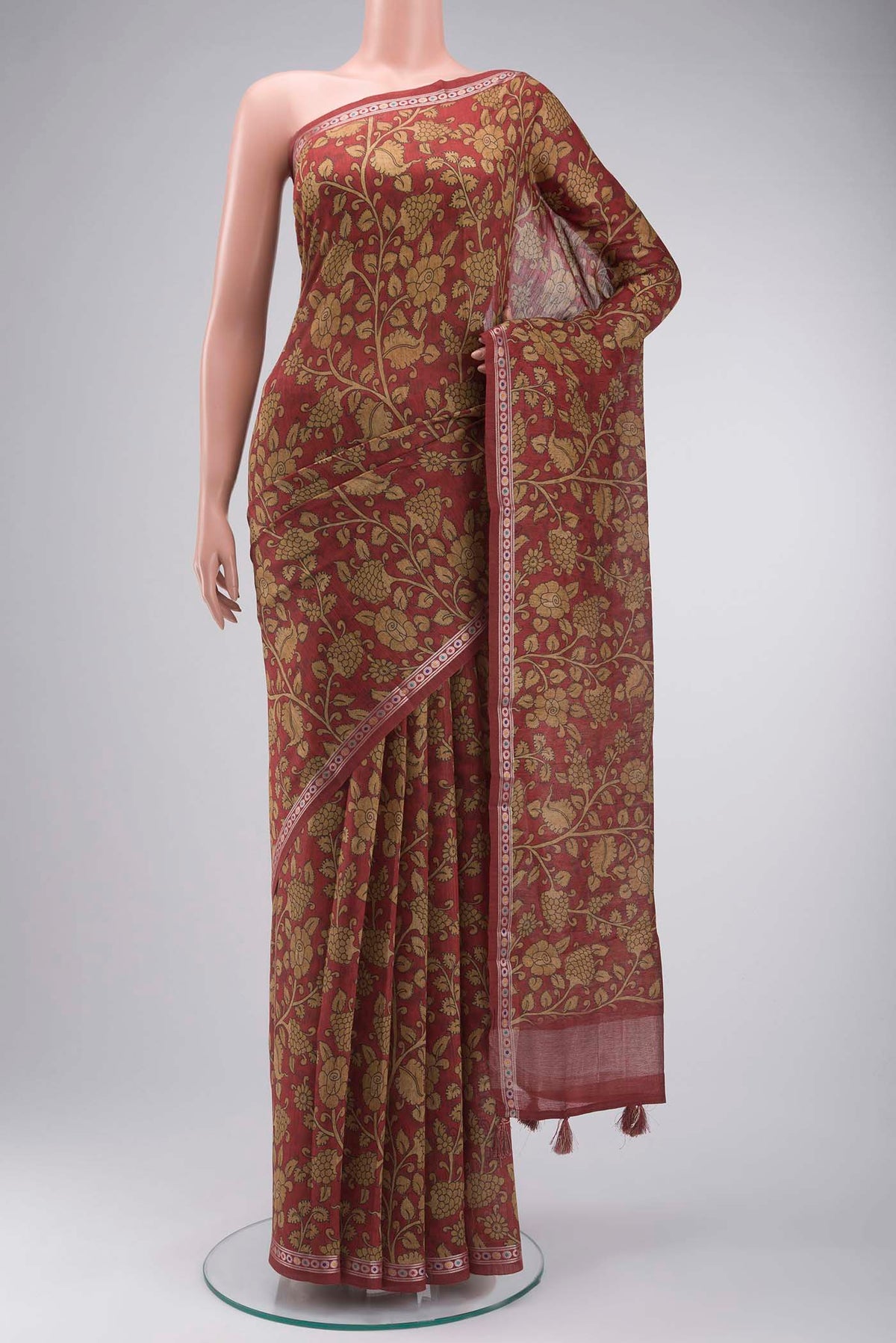 Maroon Bhagalpuri Tussar Silk Saree with Printed design on the body and Zari Border displayed on a mannequin