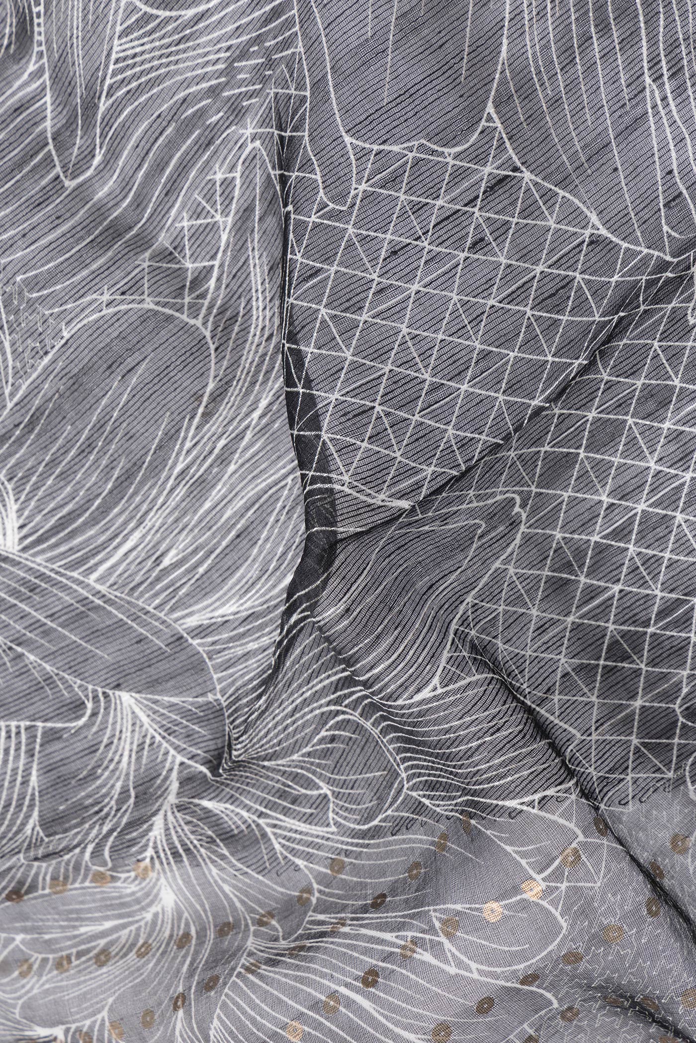Close up of Black Dual Tone Tussar Silk Saree with Printed design on the body and Without Border.  displaying folds