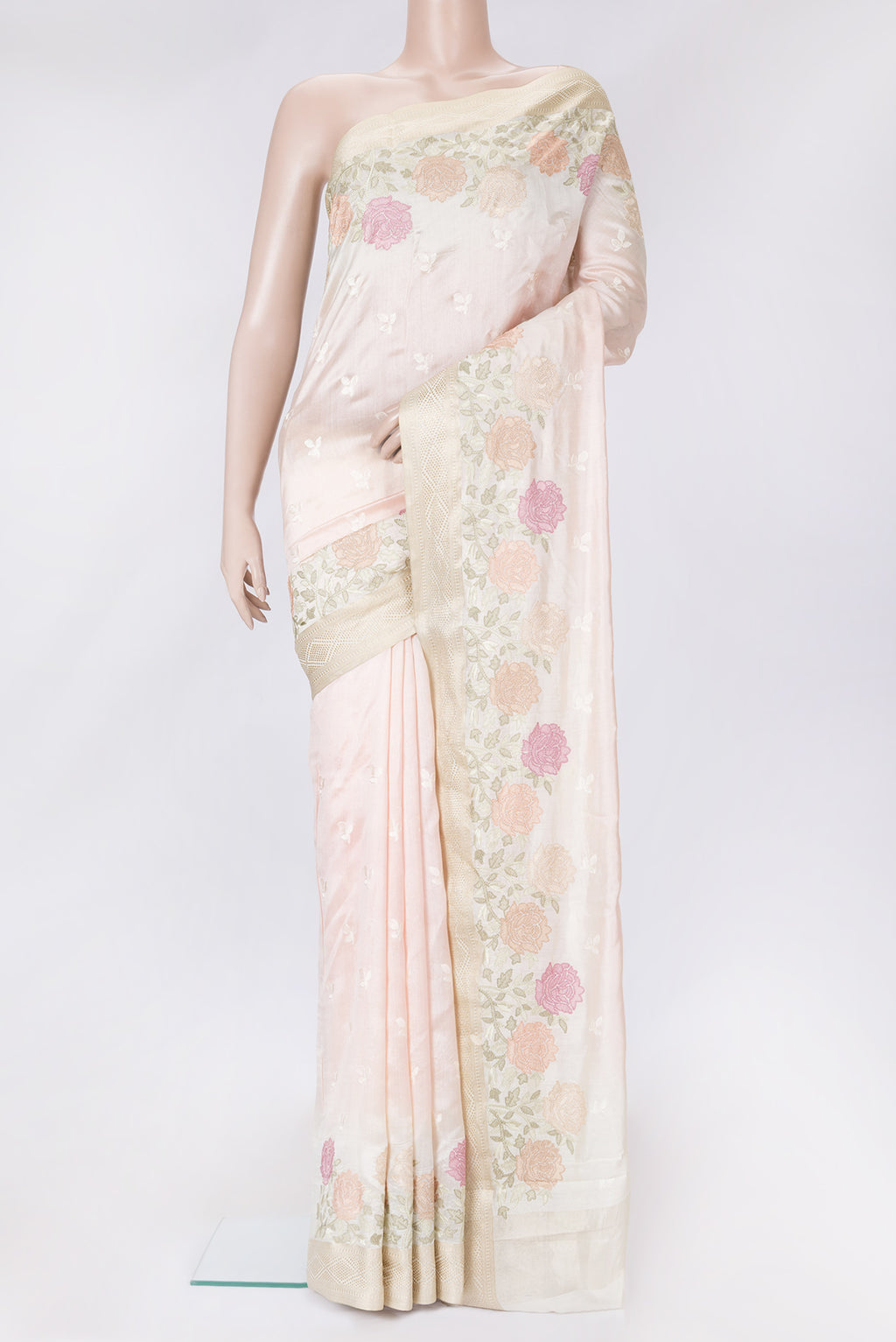 Rose Gold Dual Tone Tussar Silk Saree with Embroidery on the body and Zari Border.  displayed on a mannequin