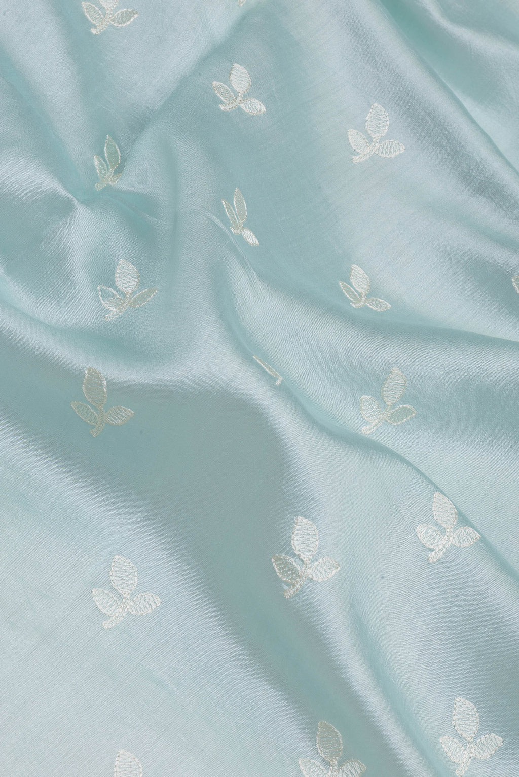 Close up of Light Blue Chanderi Silk Saree with Embroidery on the body and Embroidery Border.  displaying folds