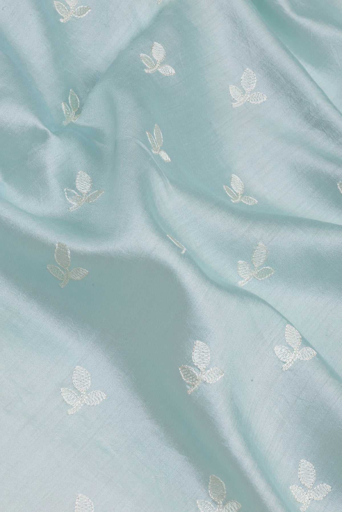 Close up of Light Blue Chanderi Silk Saree with Embroidery on the body and Embroidery Border.  displaying folds