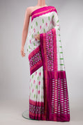 White Double Ikat Saree with Ikat Print on the body and Ikat Border.  displayed on a mannequin