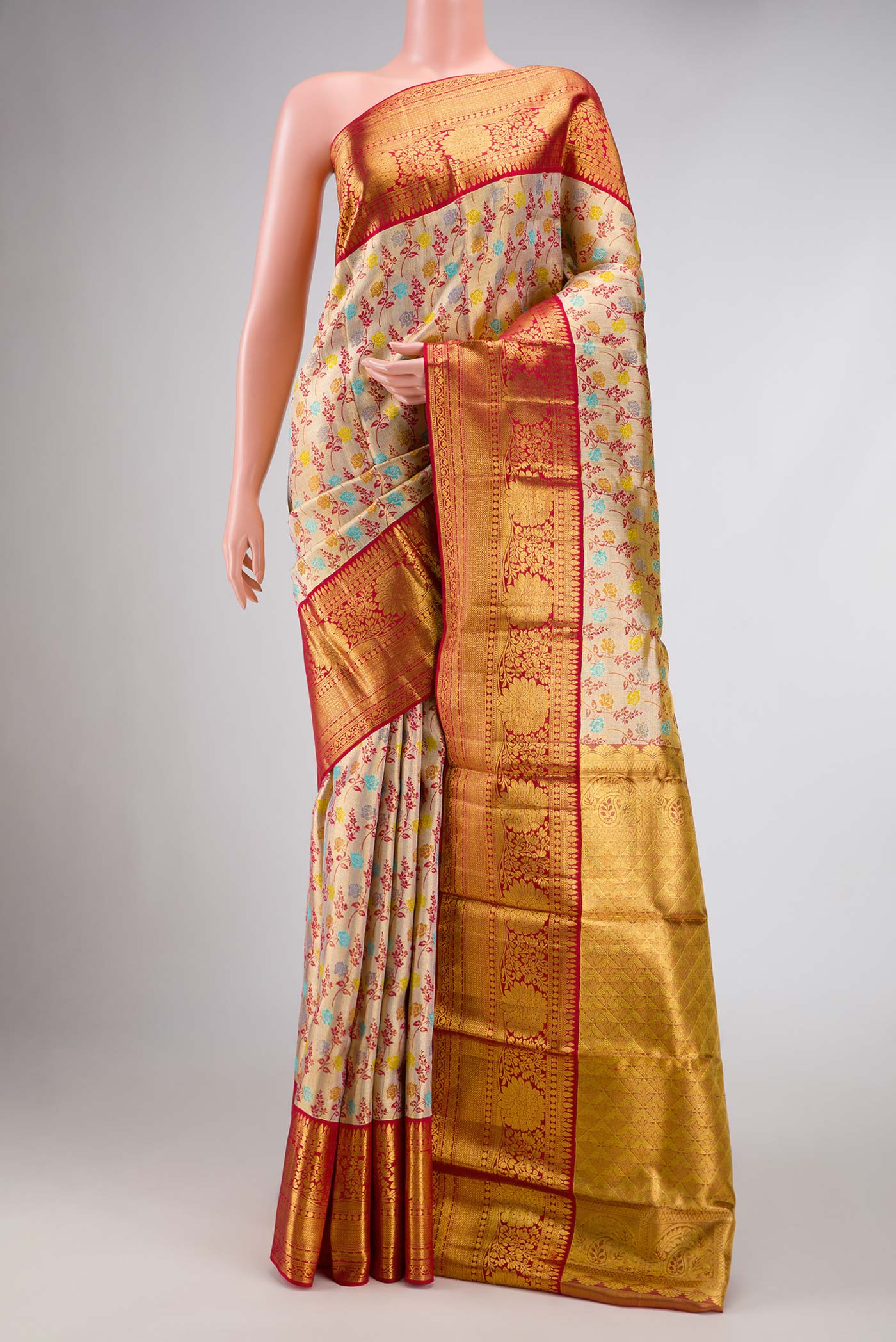 Gold Dual Tone Kanchipuram Tissue Silk Saree with Zari Brocade on the body and Zari Border.  displayed on a mannequin