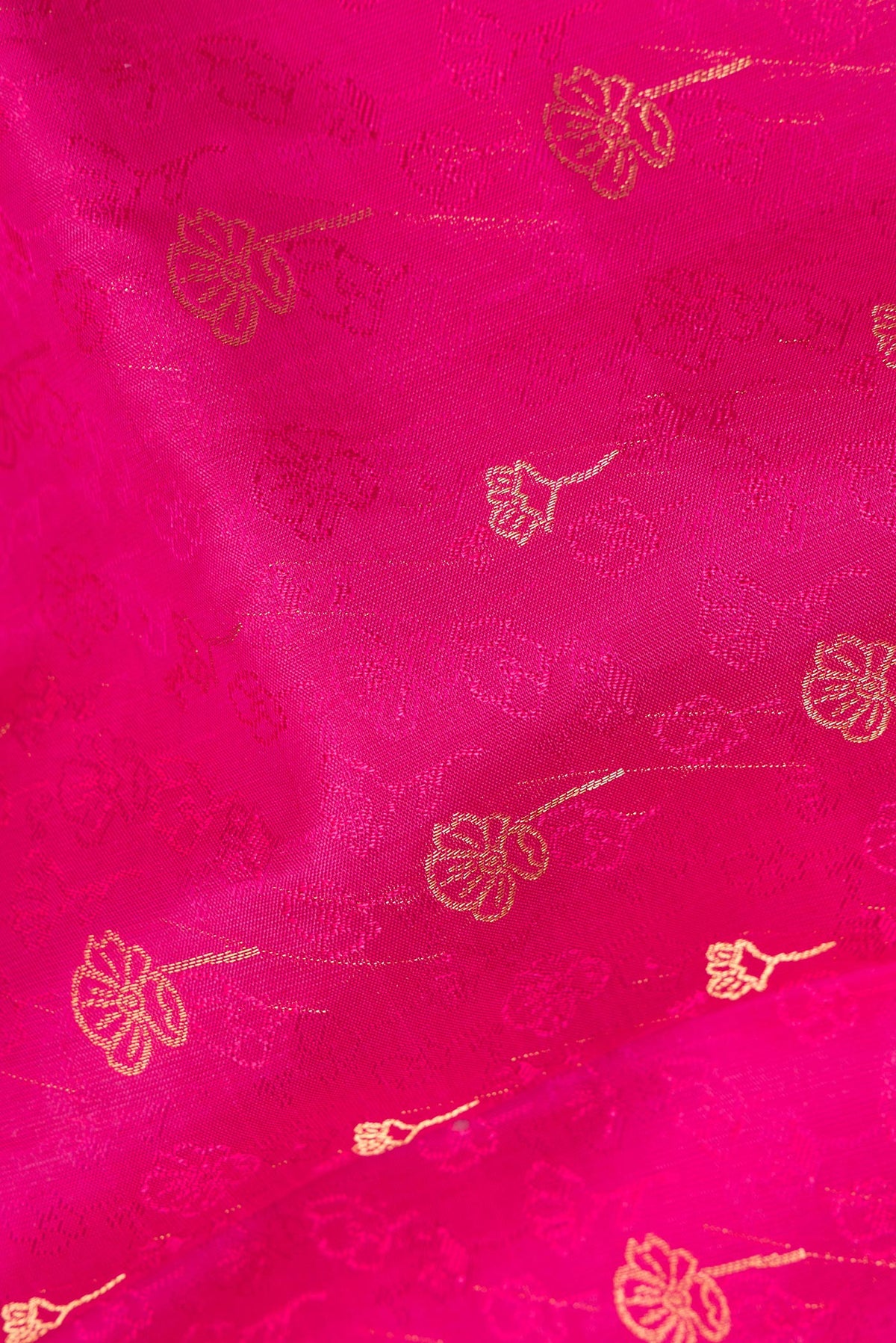 Close up of Pure Silk Pink Soft Saree with Jacquard With Zari Butta on the body and Without Border.  displaying folds