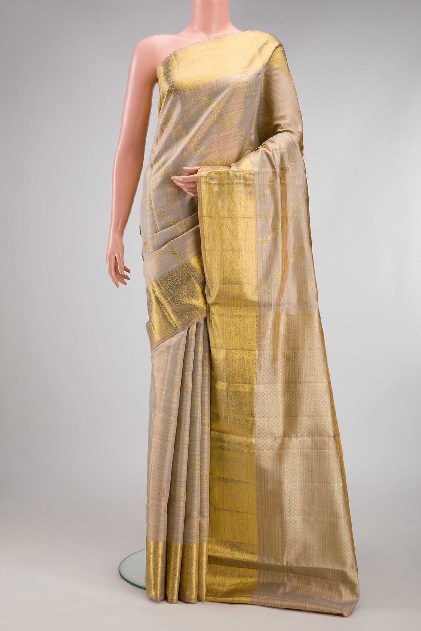 Rose Gold Dual Tone Kanchipuram Tissue Silk Saree with Zari Brocade on the body and Zari Border.  displayed on a mannequin