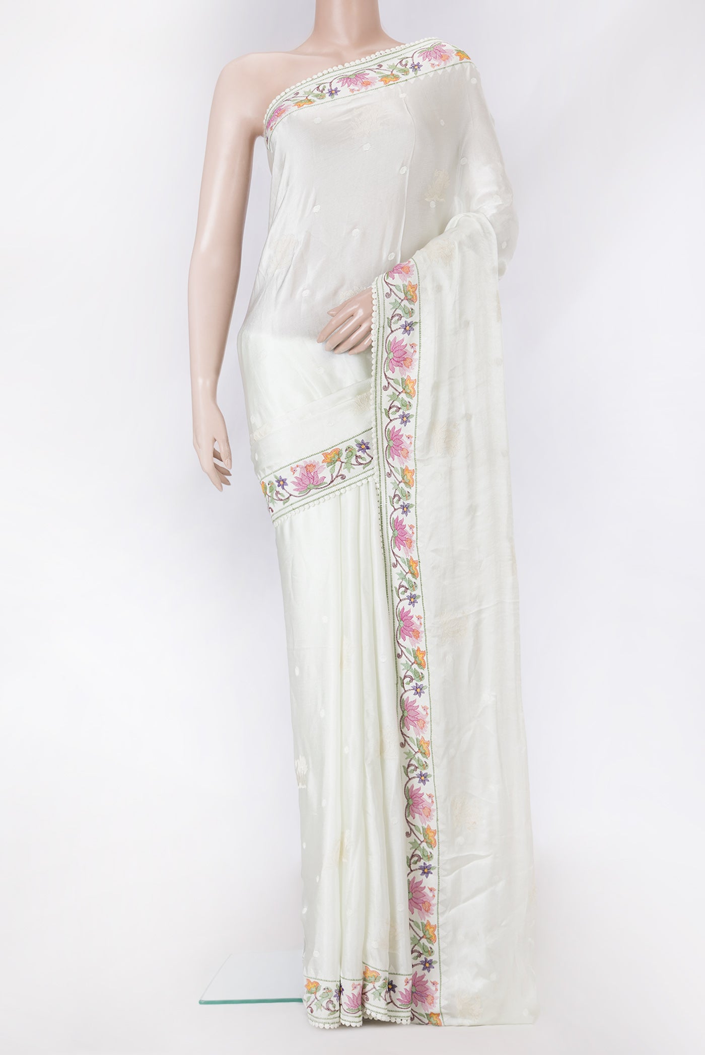 Pista Green Dual Tone Mysore Crepe Saree with Embroidery on the body and Embroidery Border.  displayed on a mannequin