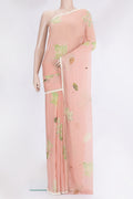 Peach Georgette Saree with Embroidery on the body and Embroidery Border.  displayed on a mannequin