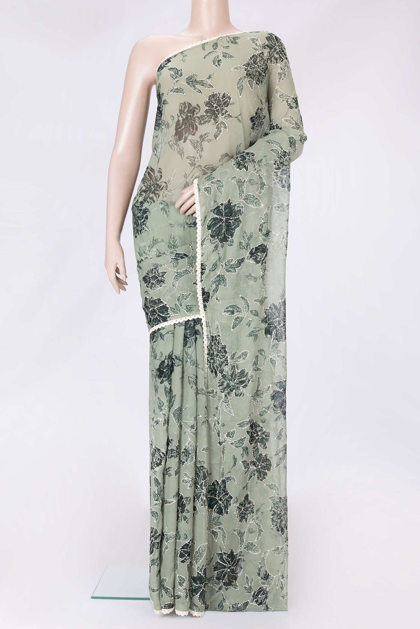 Light Green Dual Tone Mysore Georgette Saree with Embroidery on the body and Embroidery Border.  displayed on a mannequin