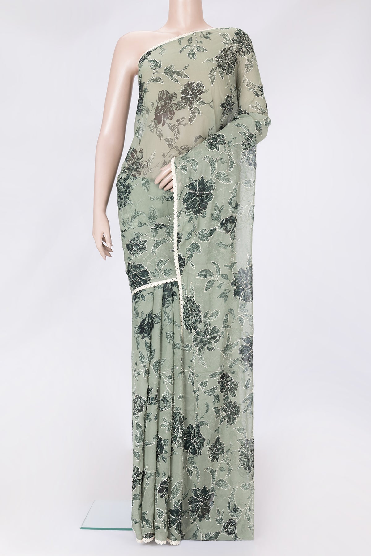 Light Green Dual Tone Mysore Georgette Saree with Embroidery on the body and Embroidery Border.  displayed on a mannequin