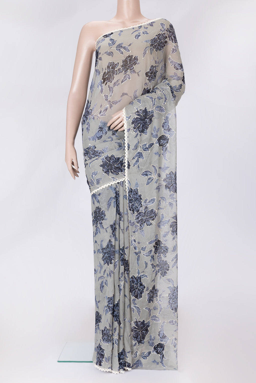 Grey Dual Tone Mysore Georgette Saree with Embroidery on the body and Embroidery Border.  displayed on a mannequin
