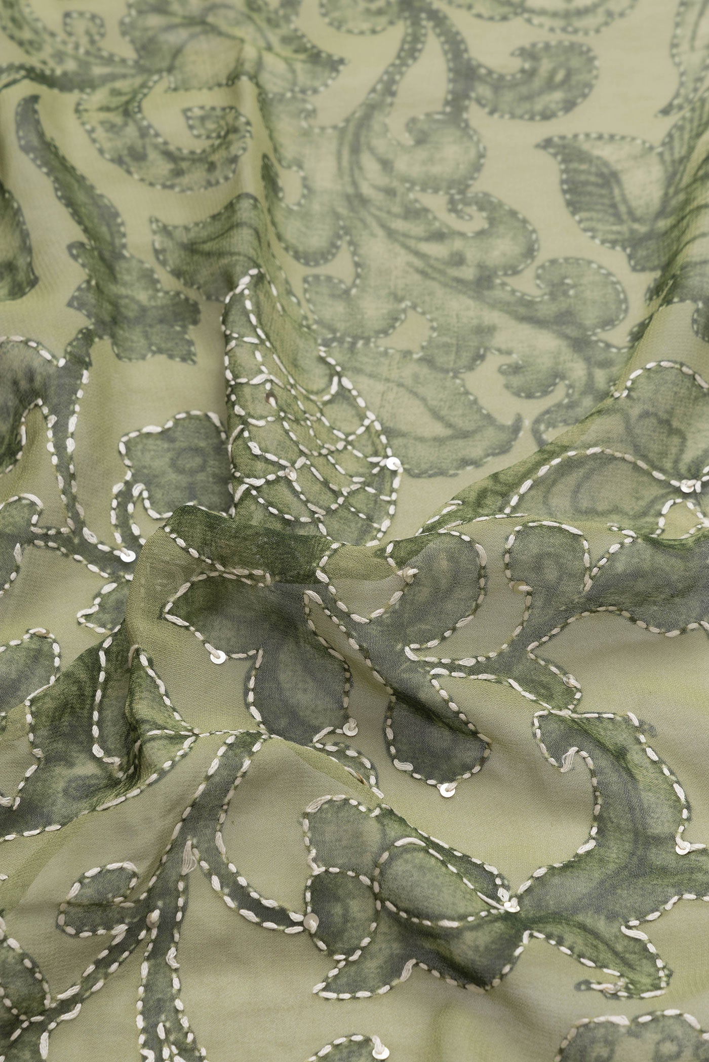 Close up of Green Dual Tone Mysore Georgette Saree with Embroidery on the body and Embroidery Border.  displaying folds