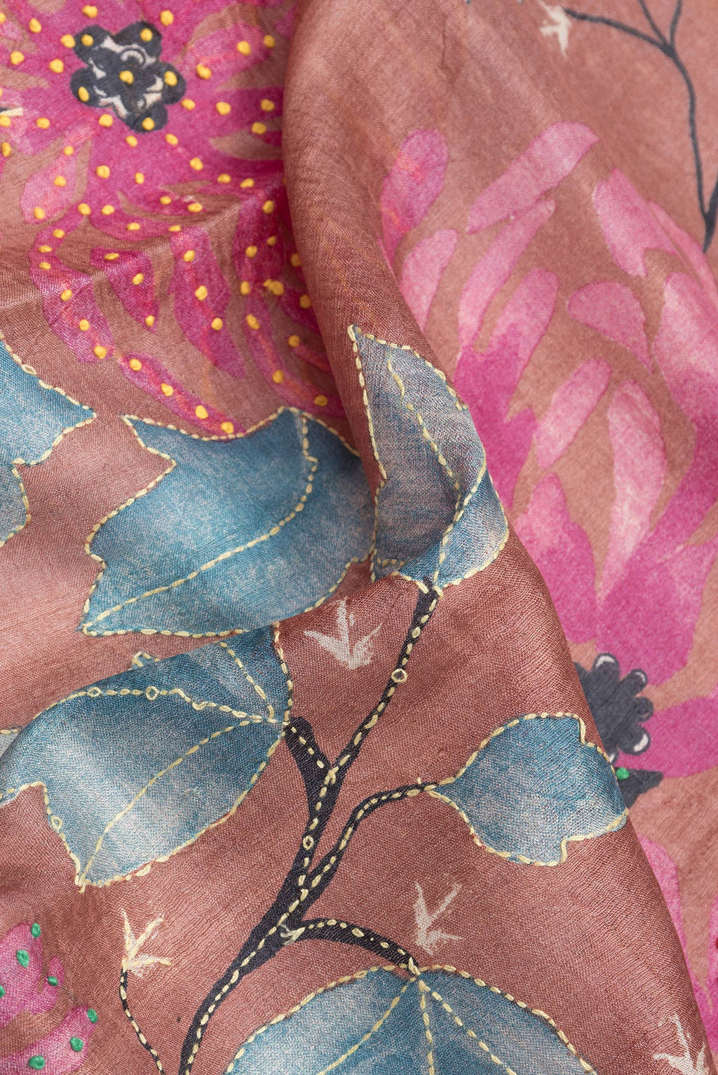 Close up of Rose Gold Dual Tone Tussar Silk Saree with Embroidery on the body and Zari Border.  displaying folds