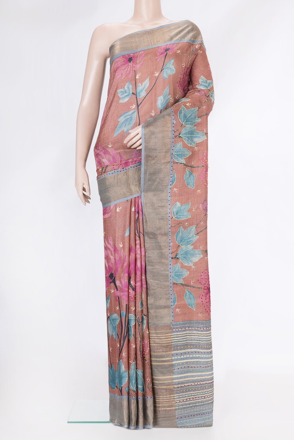 Rose Gold Dual Tone Tussar Silk Saree with Embroidery on the body and Zari Border.  displayed on a mannequin
