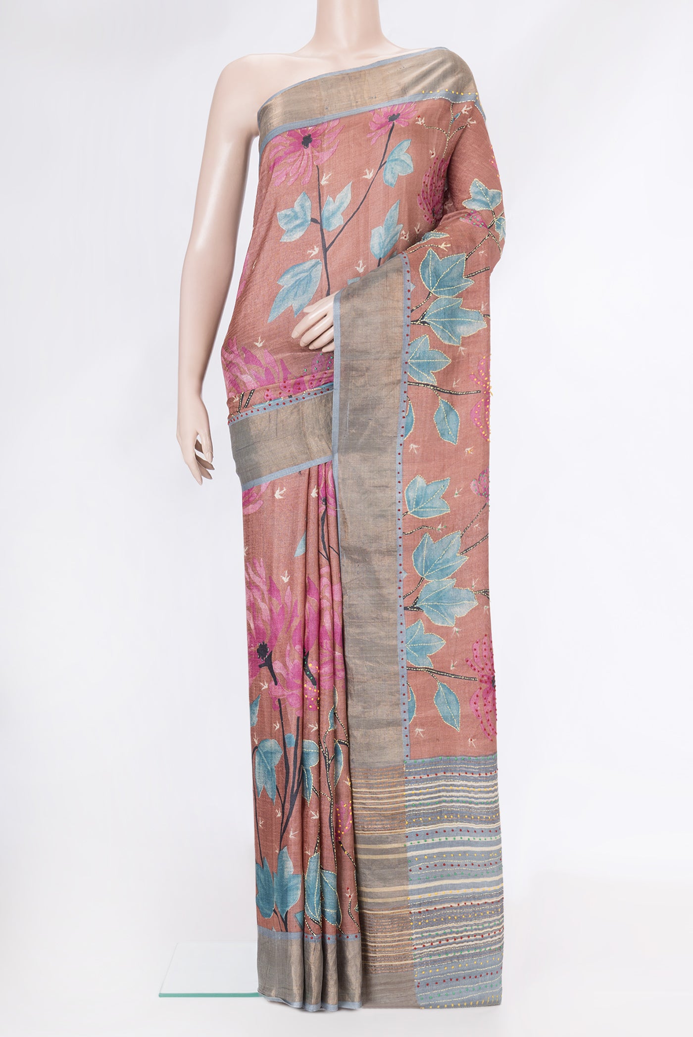 Rose Gold Dual Tone Tussar Silk Saree with Embroidery on the body and Zari Border.  displayed on a mannequin