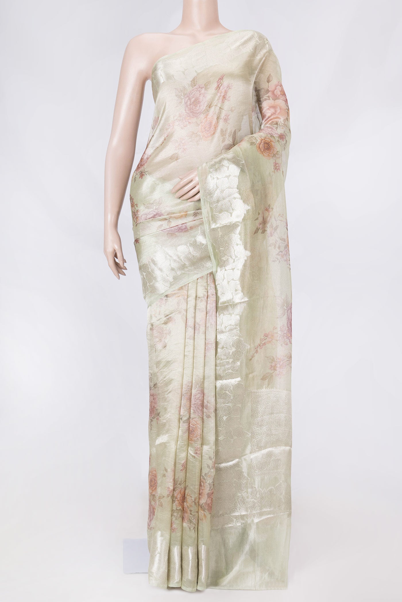 Green Dual Tone Organza Silk Saree with Printed design on the body and Zari Border displayed on a mannequin