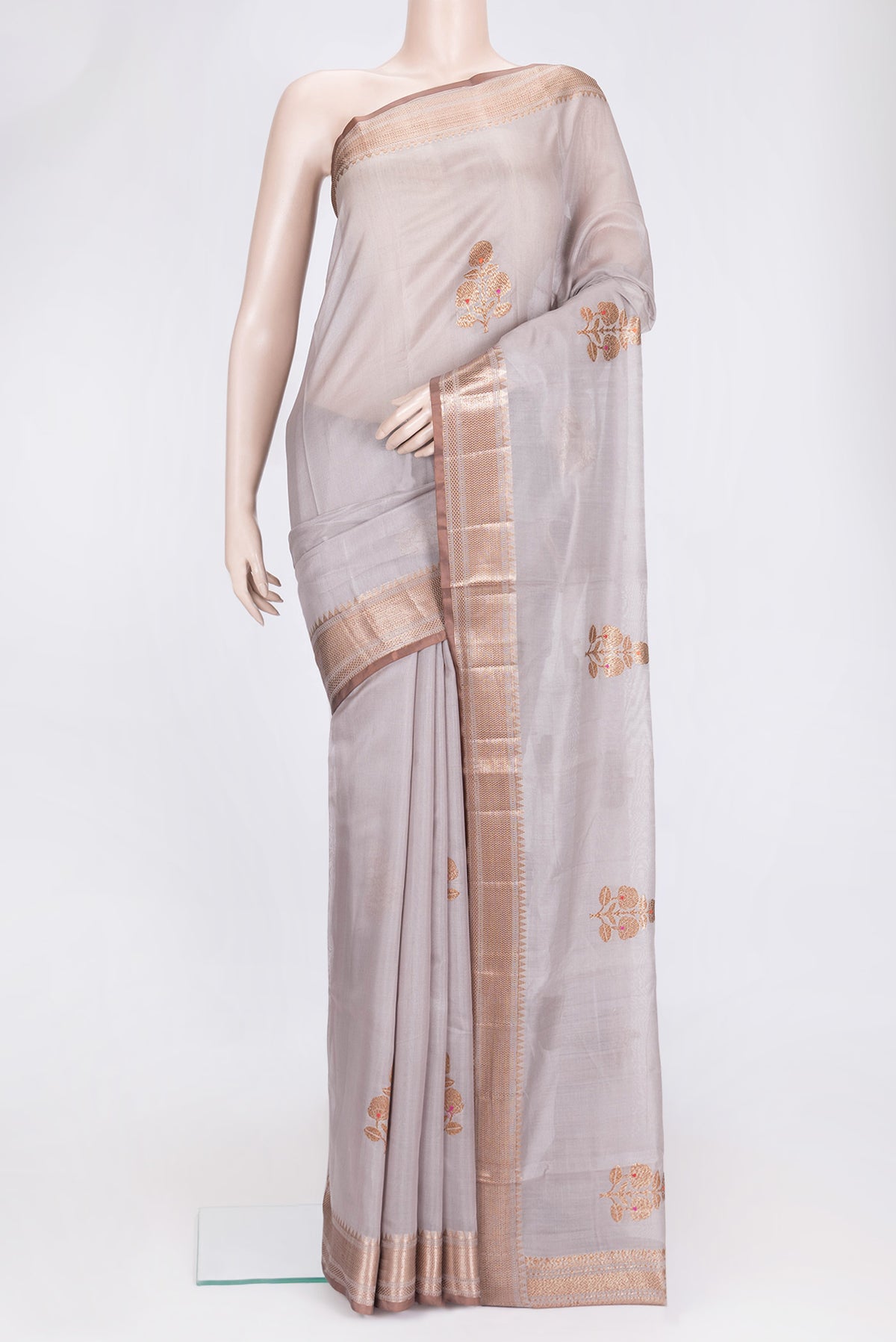 Grey Dual Tone Tussar Silk Saree with Zari Butta on the body and Zari Border.  displayed on a mannequin
