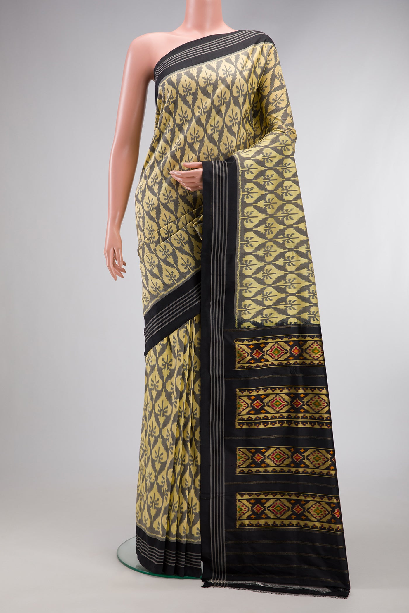 Sandal Dual Tone Double Ikat Saree with Ikat Print on the body and Thread Border.  displayed on a mannequin
