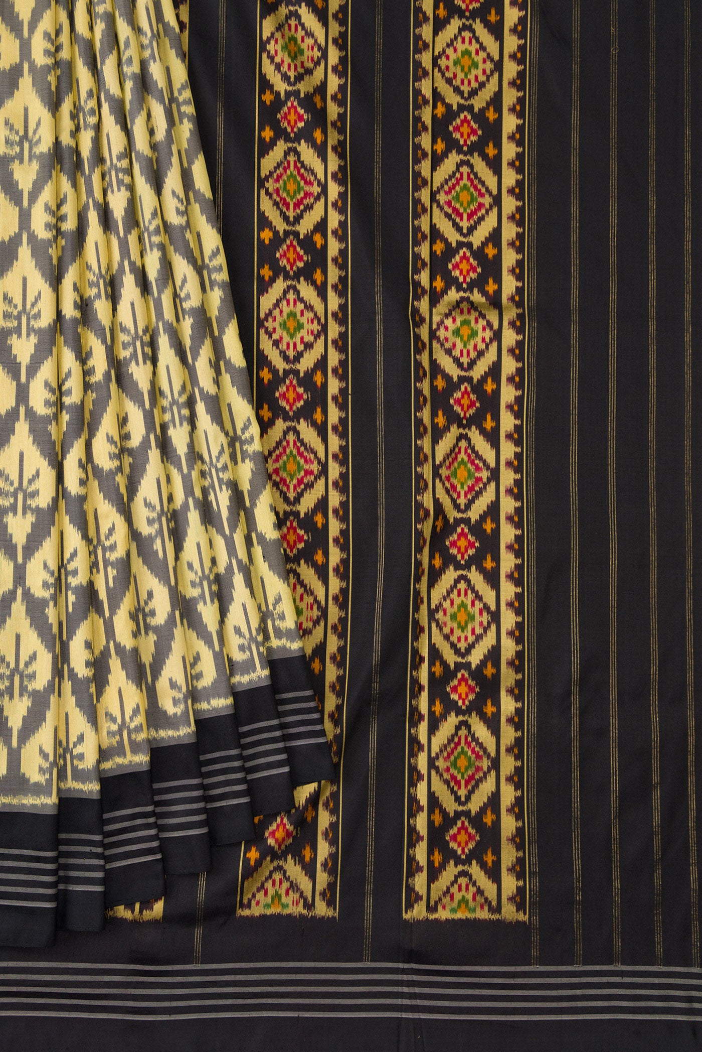 Pleats and pallu of Sandal Dual Tone Double Ikat Saree with Ikat Print on the body and Thread Border. 