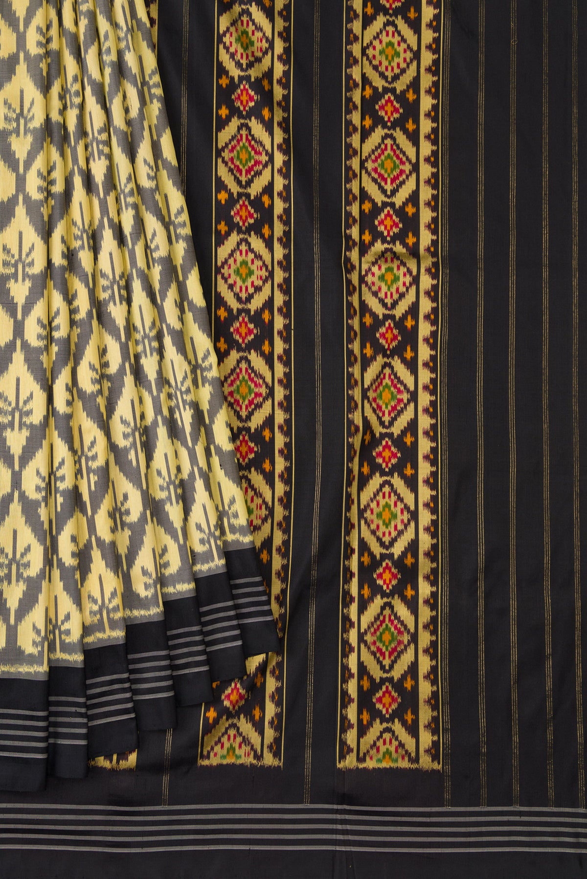 Pleats and pallu of Sandal Dual Tone Double Ikat Saree with Ikat Print on the body and Thread Border. 