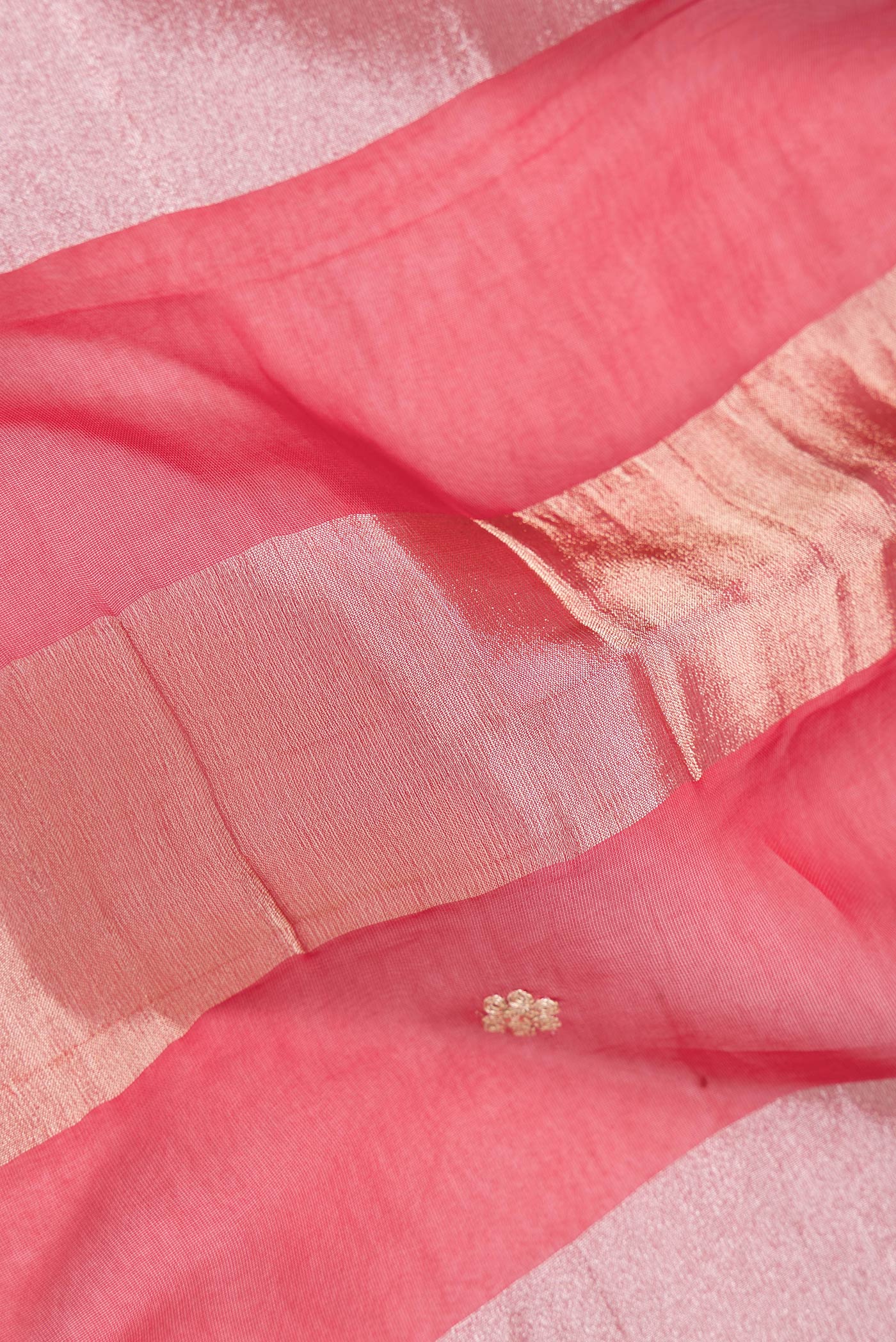 Close up of Red Dual Tone Banarasi Georgette Saree with Stripes on the body and Embroidery Border.  displaying folds