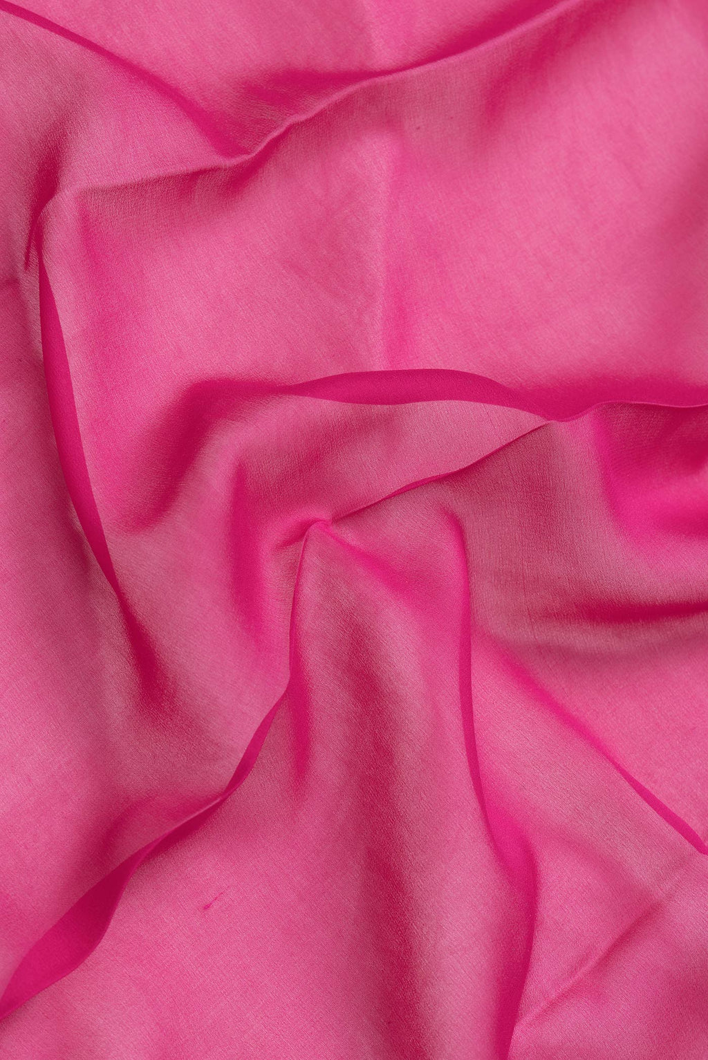 Close up of Pink Dual Tone Mysore Georgette Saree with Plain Body and Temple Border.  displaying folds