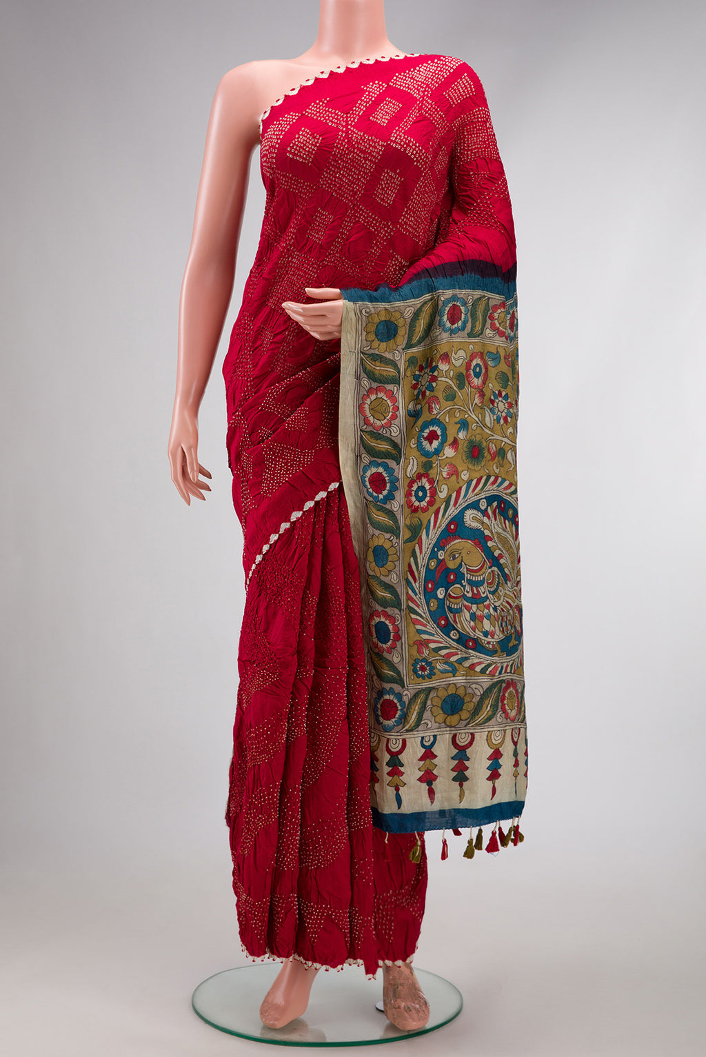 Maroon Dual Tone Bandhani Silk Saree with Bandhani Print on the body and Printed Border.  displayed on a mannequin