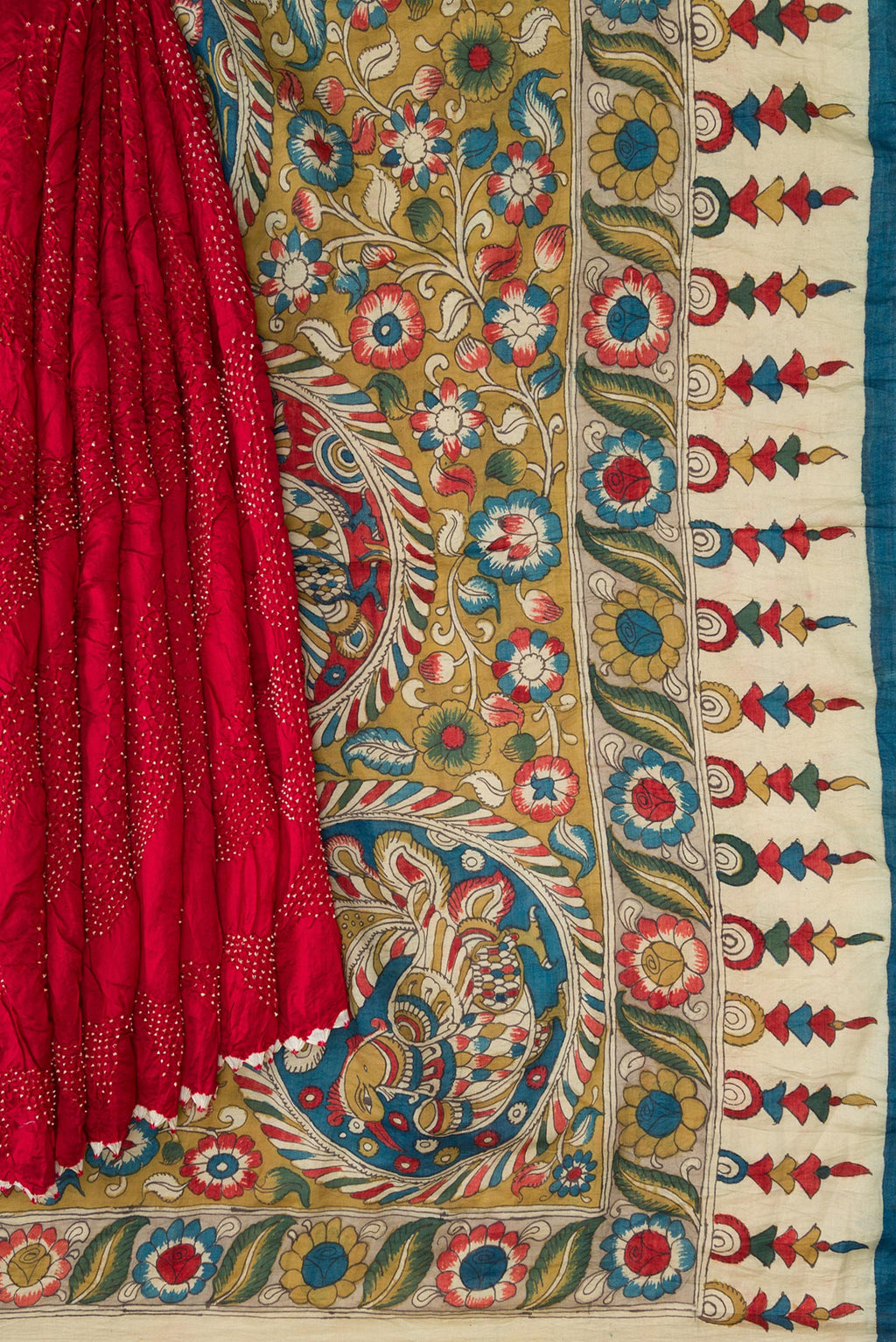 Pleats and pallu of Maroon Dual Tone Bandhani Silk Saree with Bandhani Print on the body and Printed Border. 