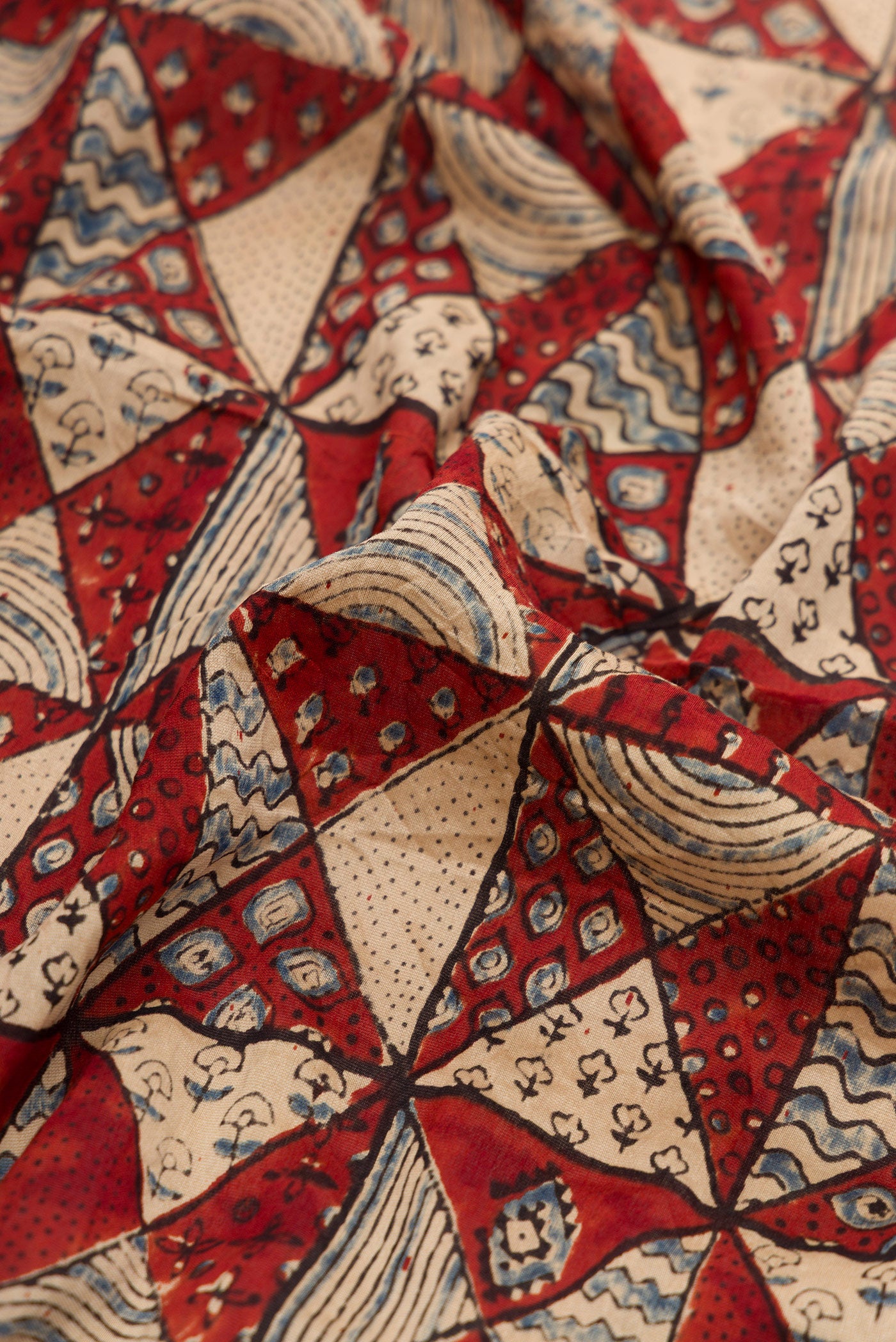 Close up of Maroon Dual Tone Bandhani Silk Saree with Bandhani Print on the body and Printed Border.  displaying folds