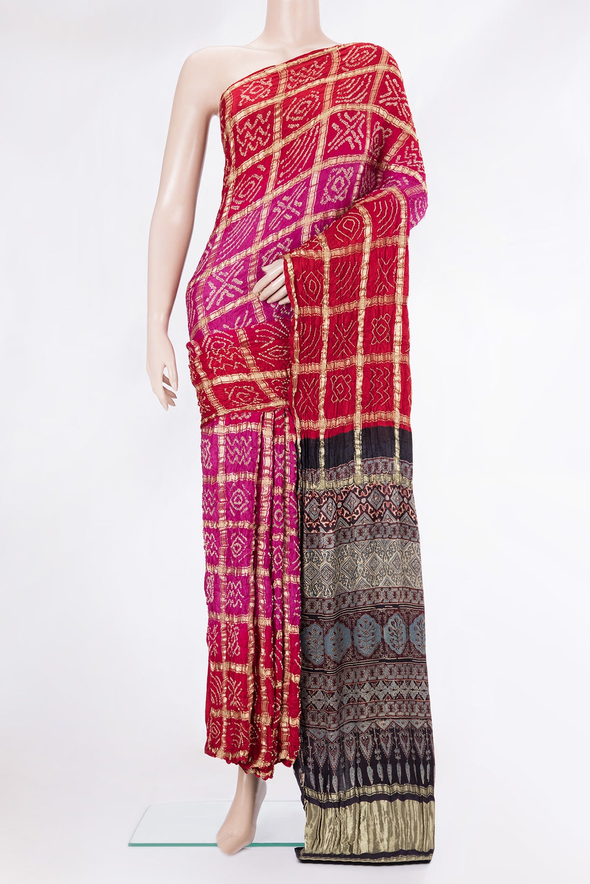 Pure Silk Pink and Red Color Bandhani Saree with Bandhani on the body and Without Border.  displayed on a mannequin