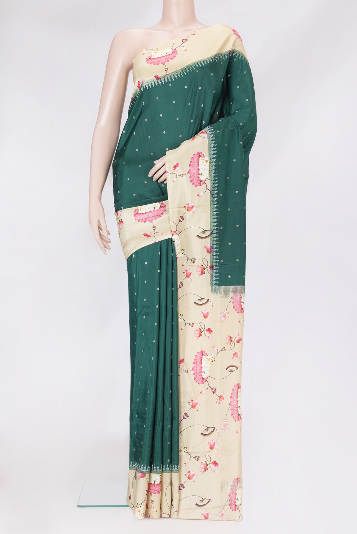 Bottle Green Kanjivaram Silk Saree with Zari Butta on the body and Fancy Border.  displayed on a mannequin