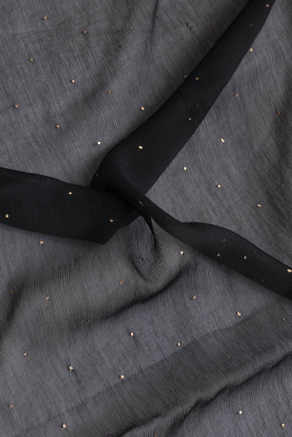 Close up of Black Dual Tone Mysore Chiffon Saree with Embroidery on the body and Embroidery Border.  displaying folds