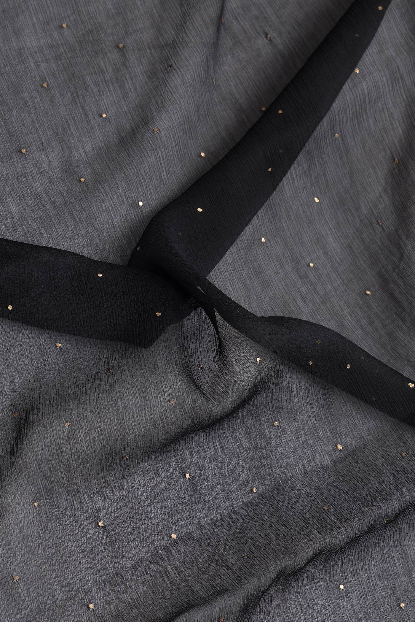 Close up of Black Dual Tone Mysore Chiffon Saree with Embroidery on the body and Embroidery Border.  displaying folds