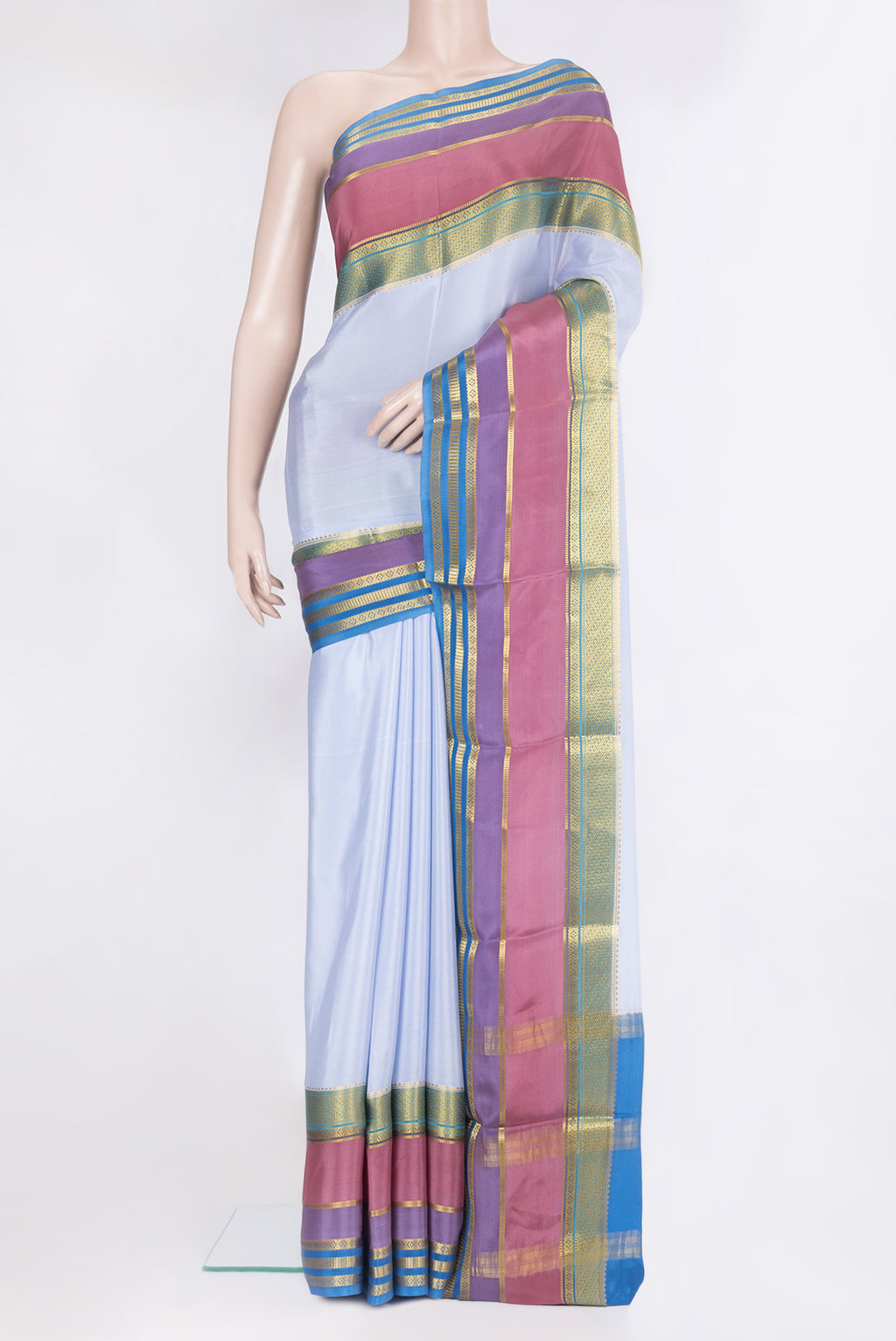Maya Blue Mysore Silk Saree with Plain Body and Zari Border.  displayed on a mannequin