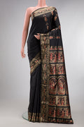 Pure Silk Black Baluchari Saree with Zari And Thread Butta on the body and Fancy Border.  displayed on a mannequin