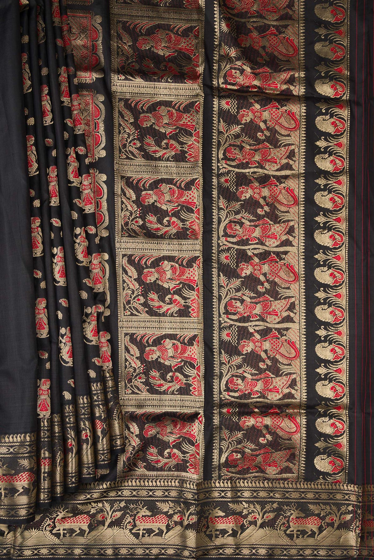 Pleats and pallu of Pure Silk Black Baluchari Saree with Zari And Thread Butta on the body and Fancy Border. 