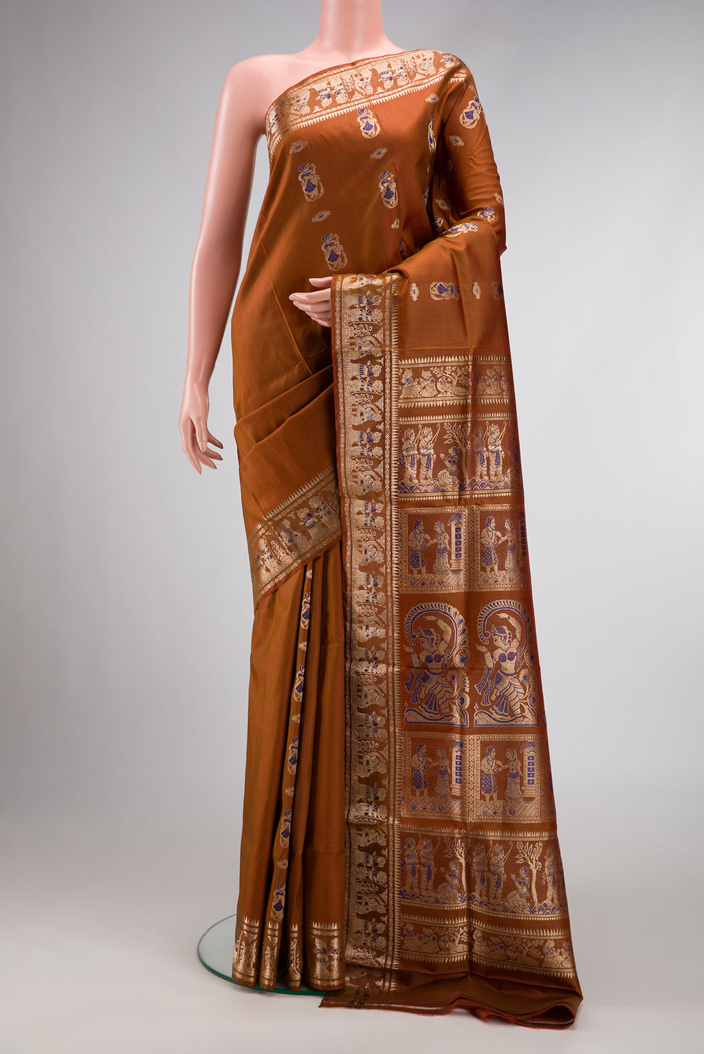 Caramel Dual Tone Baluchari Silk Saree with Zari And Thread Butta on the body and Fancy Border.  displayed on a mannequin