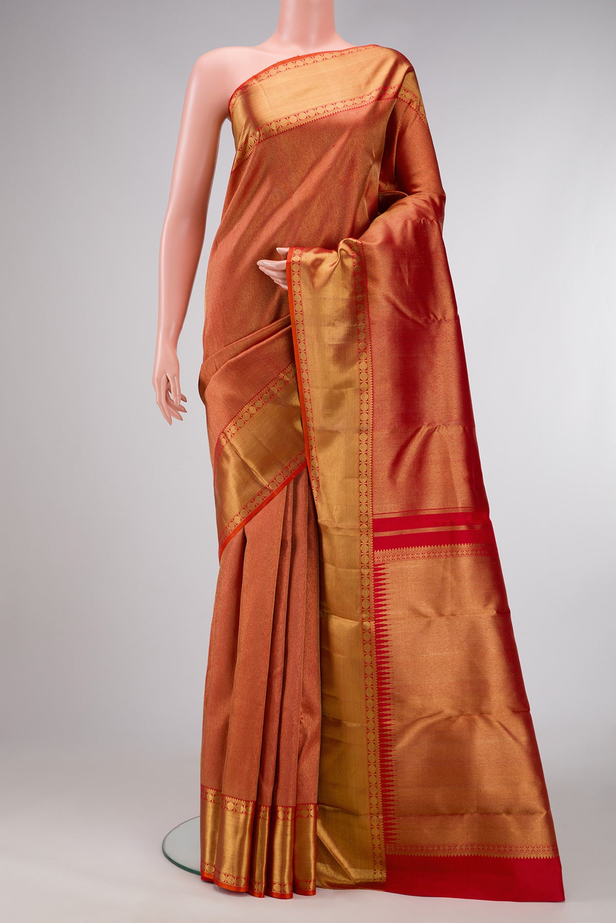 Pure Silk Pure Zari Red Dual Tone Kanjivaram Saree with Zari Brocade on the body and Zari Border.  displayed on a mannequin