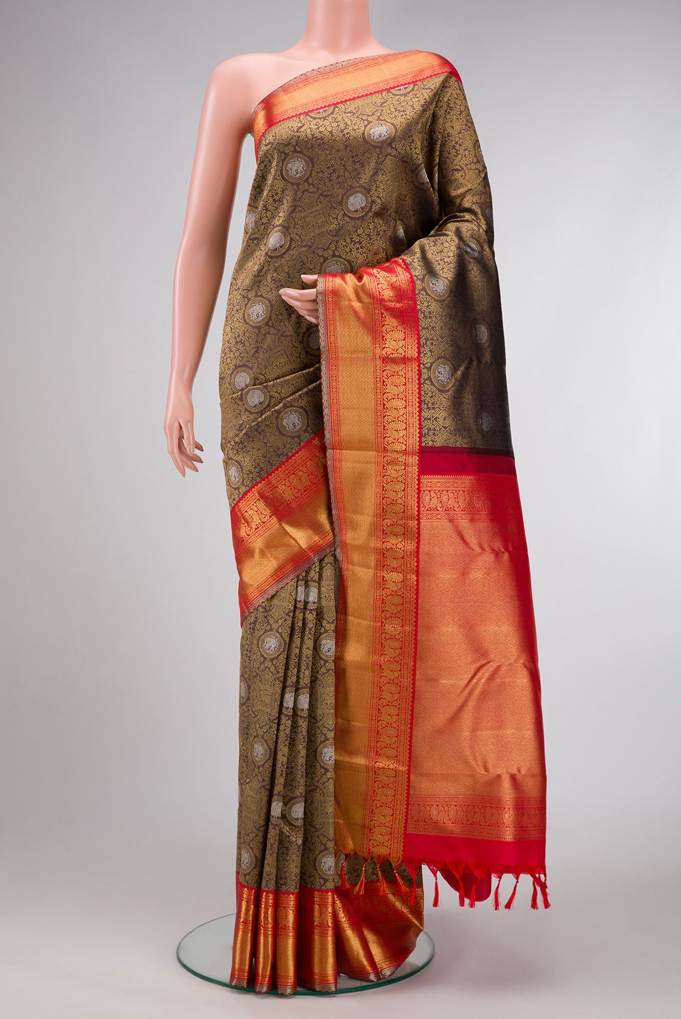 Pure Silk Pure Zari Brown Dual Tone Kanjivaram Saree with Zari Brocade on the body and Zari Border.  displayed on a mannequin