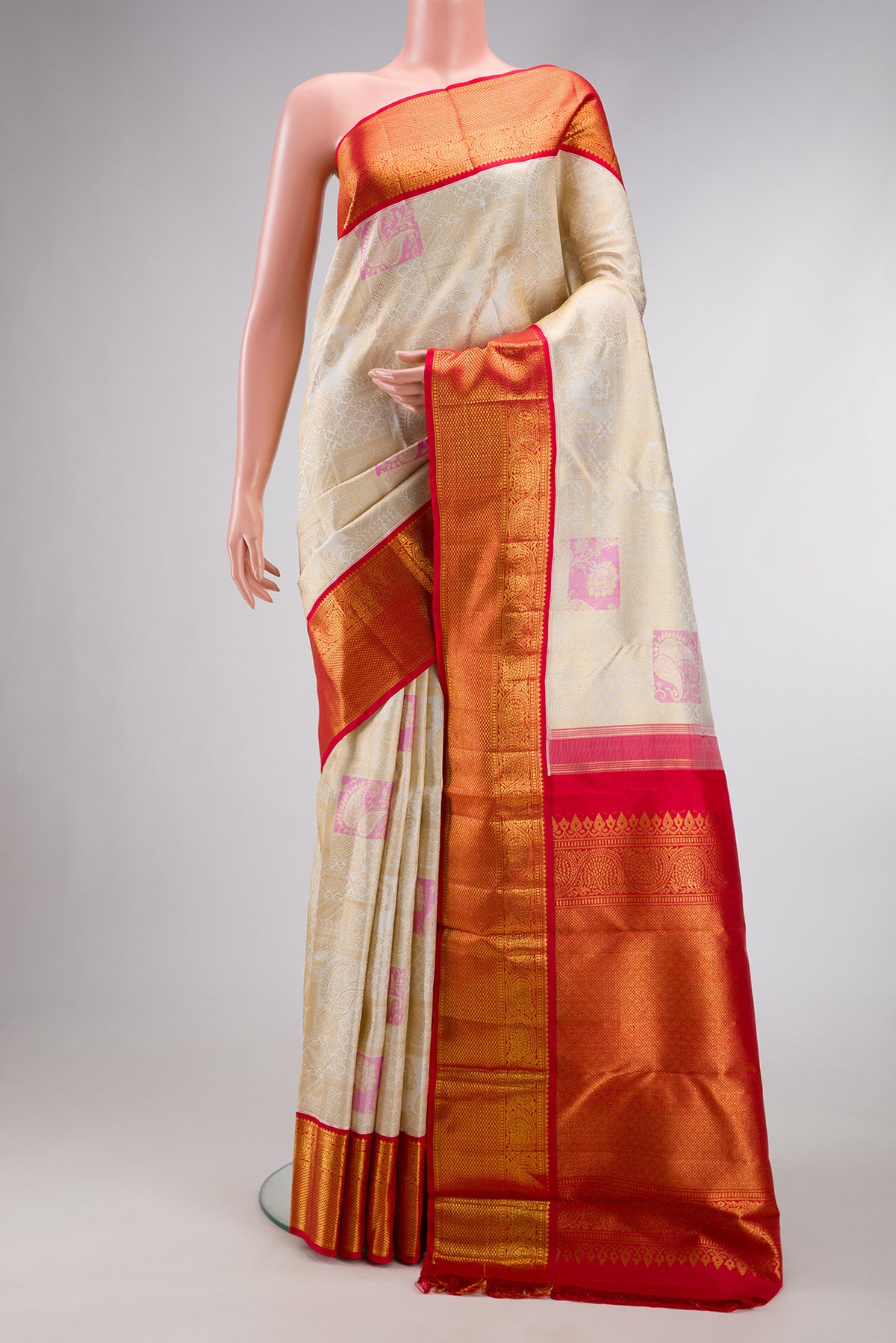 Off White Dual Tone Kanchipuram Silk Saree with Zari Brocade on the body and Zari Border.  displayed on a mannequin
