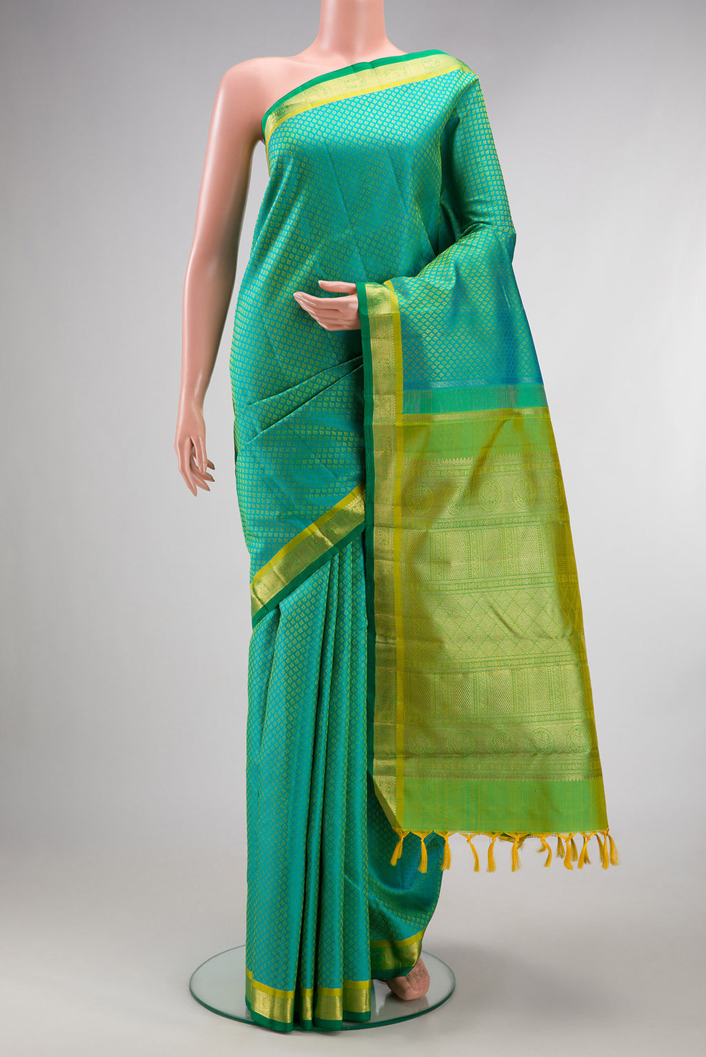 Pure Silk Pure Zari Sea Green Dual Tone Kanchipuram Saree with Jacquard design on the body and Zari Border.  displayed on a mannequin