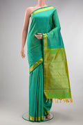 Pure Silk Pure Zari Sea Green Dual Tone Kanchipuram Saree with Jacquard design on the body and Zari Border.  displayed on a mannequin