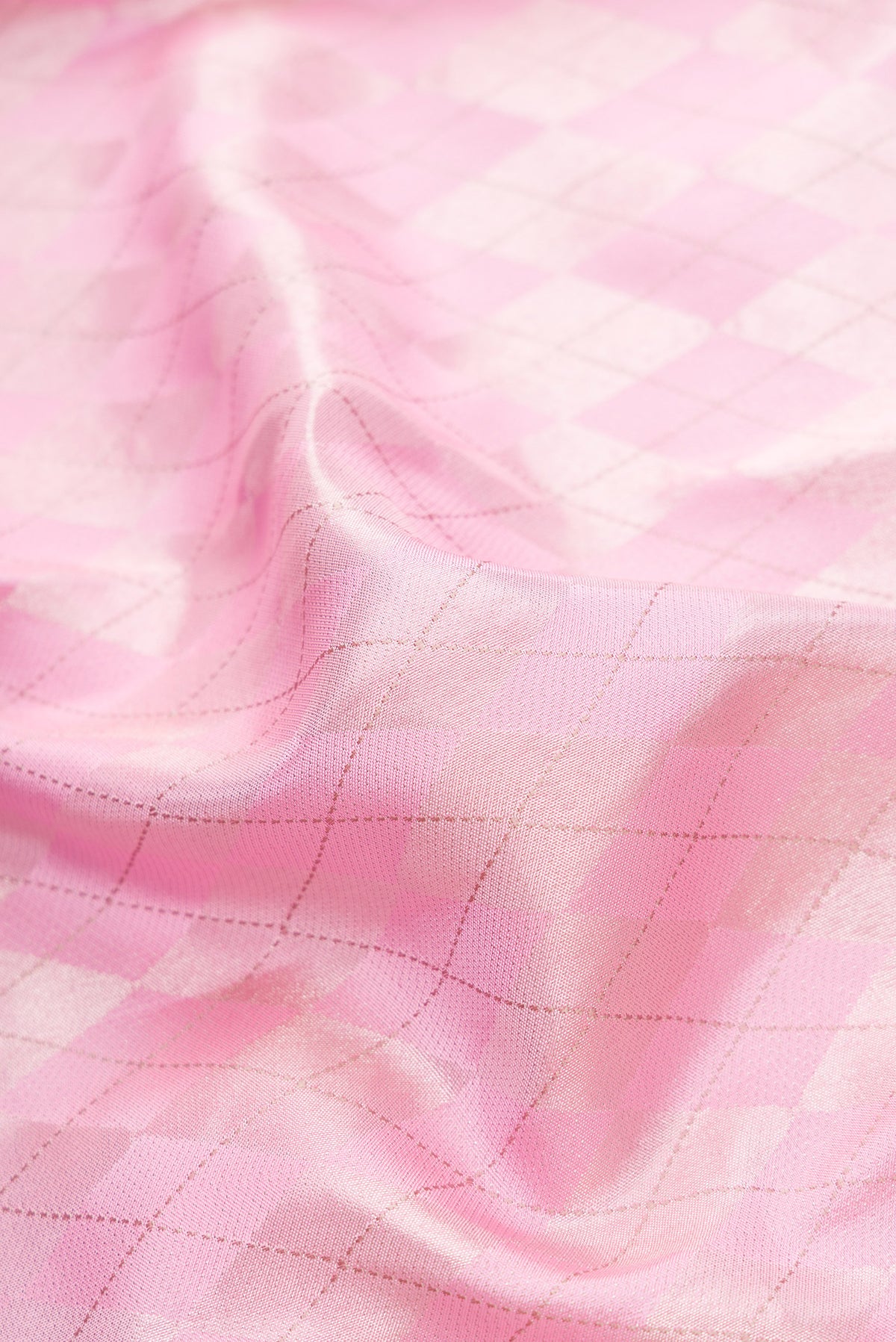 Close up of Rose pink Dual Tone Kanjivaram Silk Saree with Zari Brocade on the body and Fancy Border.  displaying folds