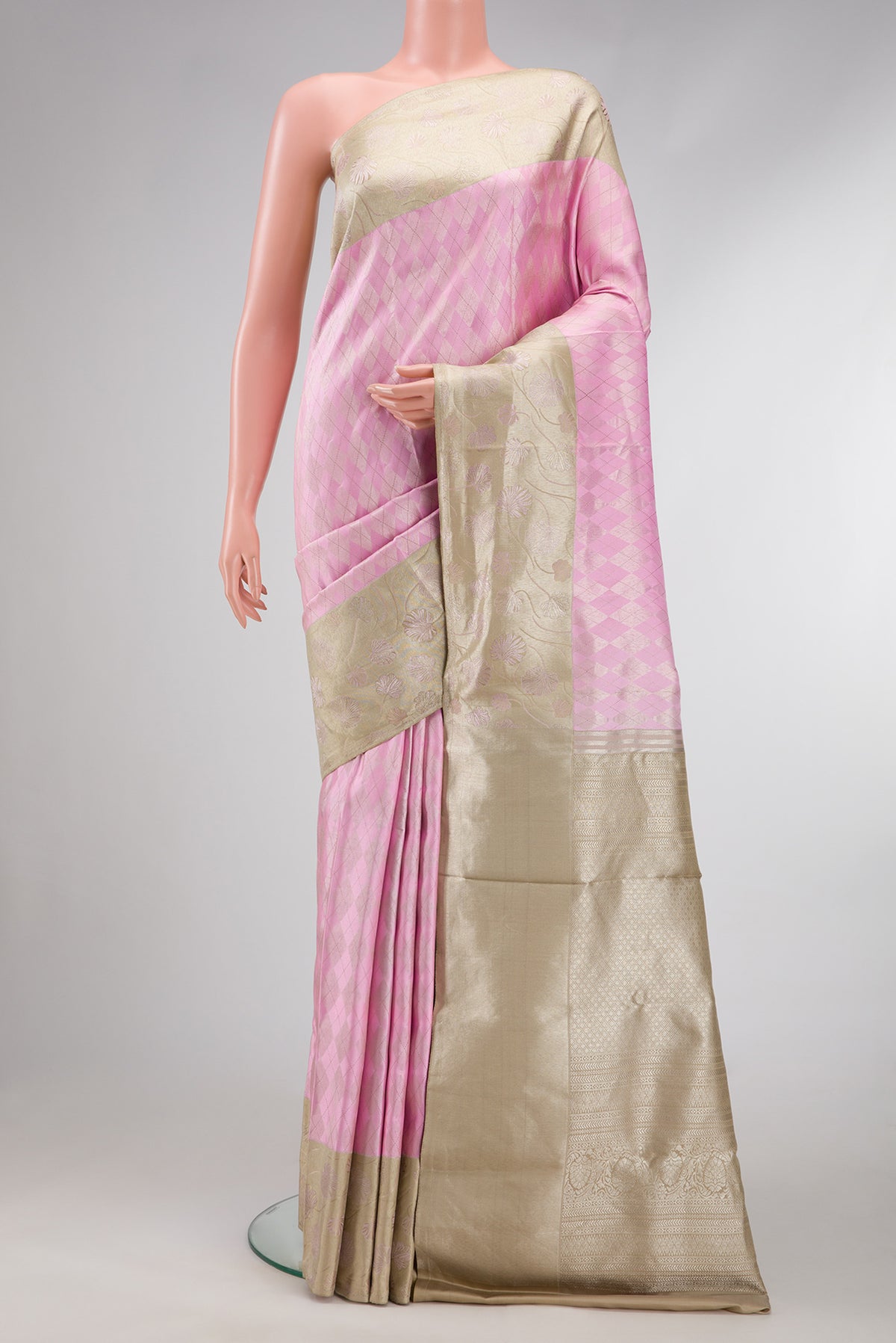 Rose pink Dual Tone Kanjivaram Silk Saree with Zari Brocade on the body and Fancy Border.  displayed on a mannequin